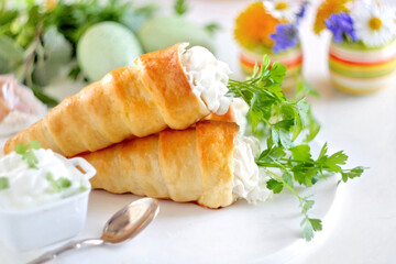 Stuffed crescent roll carrots on white background. Selective focus.