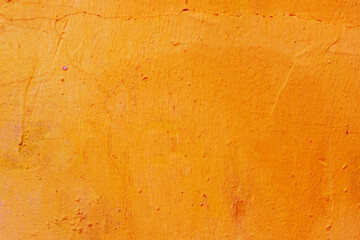 Old grunge orange wall texture background.