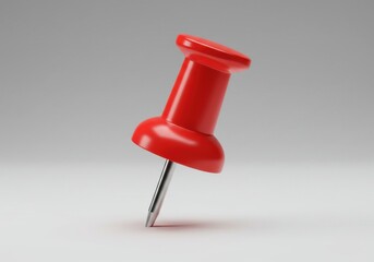 A single red push pin close isolated on white background