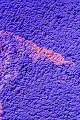 Vertical photo of blue plaster with a stain.