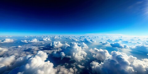 Naklejka premium An Expansive Aerial View of a Sea of Cumulus Clouds Underneath a Vivid Azure Sky