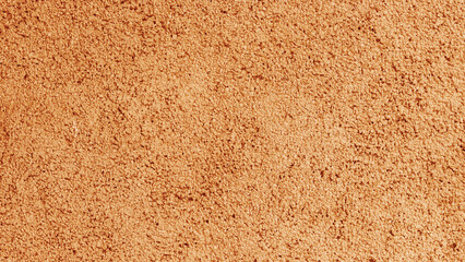 Abstract background made of orange plaster.