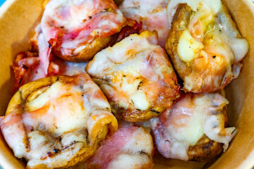 Delicious homemade mushroom bites topped with cheese and bacon