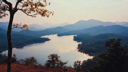 Serene scenic landscape featuring a river and distant mountain ranges