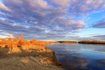 A beautiful, serene landscape with a lake and a river