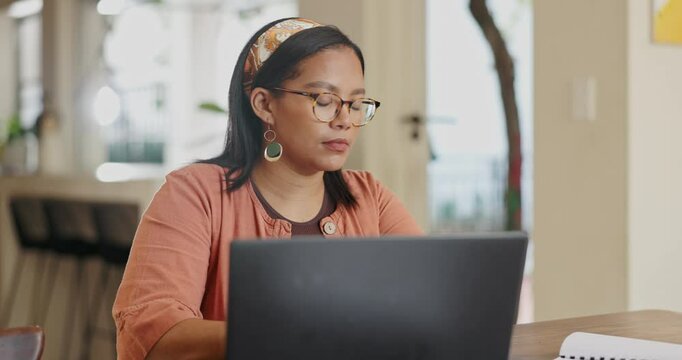 Woman, computer and work from home documents for planning, research and creative project. Young freelancer, editor or writer typing on her laptop with paperwork, editing and report or information