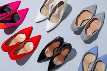 Fototapeta premium High heeled shoes on light background, flat lay