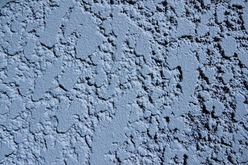 Vue de près sur un mur, avec effet de couleur bleu clair