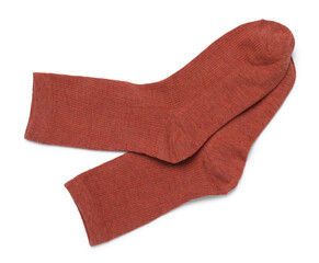 Pair of reddish brown socks isolated on white, top view