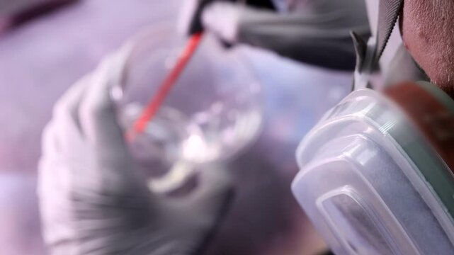 Painter Mixing Hardener for Paint