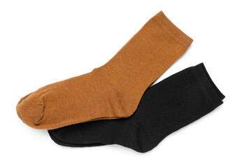 Pairs of stylish socks isolated on white, top view