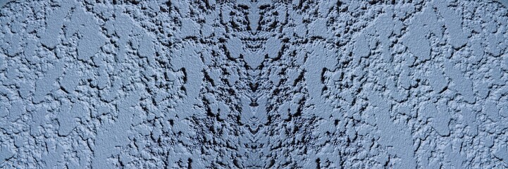 Vue de près sur un mur, avec effet de couleur bleu clair et effet symétrique
