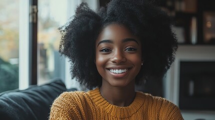 Fototapeta premium Smiling girl exudes warmth and focus in a cozy setting, radiating a sense of calm and connection. 