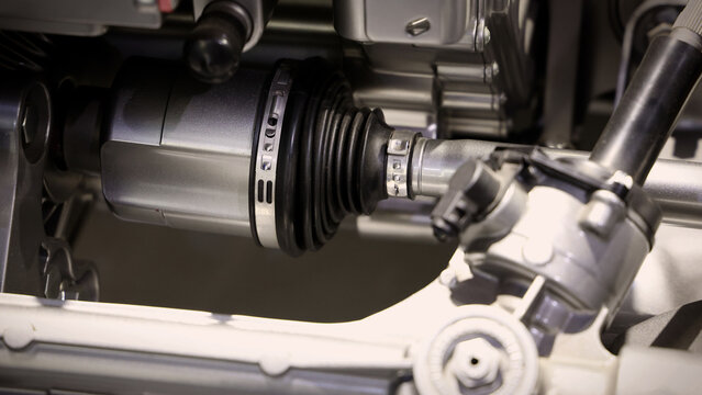 Car suspensions. Close up of a car suspension parts system such as CV joint Rubber boot and Control arms bushing Steering rack axles Shock absorber suspension Brake. Repair and spare parts for cars.