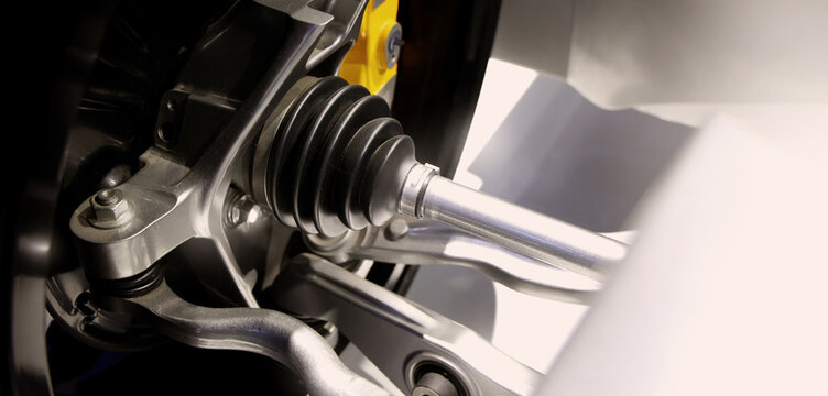 Car suspensions. Close up of a car suspension parts system such as CV joint Rubber boot and Control arms bushing Steering rack axles Shock absorber suspension Brake. Repair and spare parts for cars.