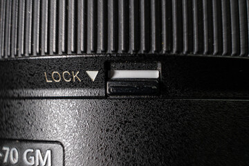 Close-up photo detail of a digital camera mode switch scroll wheel power button 
