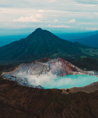 Aerial view of Misty Volcano of Kawah Ijen crater in East Java