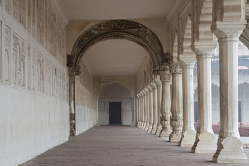 Fototapeta premium Arched corridor within Agra's Red Fort in India. UNESCO World Heritage Site. Mughal or Indo-Islamic design.