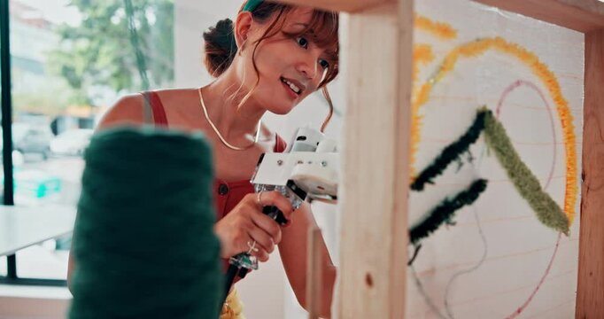 Woman, threading and wool in tool in workshop, art class and preparation for tufting in studio. Design, student or learning a skill in fashion on machine or artist in creative project on handmade rug