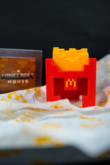 Fototapeta premium Bangkok, Thailand - April 6, 2025 : Fry Helmet Minecraft from McDonald, Toy form Minecraft blind box from McDonald's collaborates Minecraft the movice
