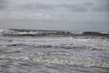 Waves on the shore and beach at Noordwijk beach