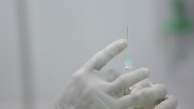 Doctor Preparing SYRINGE