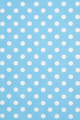 Bright blue polka dot texture background © Karen Roach