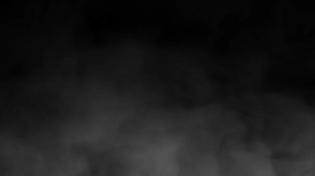 White smoke slowly floating through space against black background.