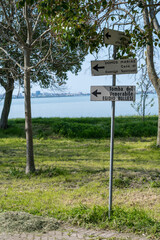 Directional signs on Barbana Island pointing to sacred places of prayer and the tomb of Venerable Egidio Bullesi by the lagoon..