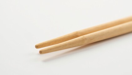 Pair of natural light brown wooden chopsticks isolated on white , asian, kitchen