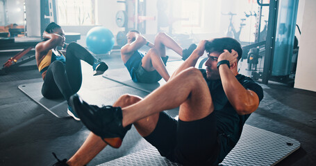 Naklejka premium Workout, people and sit ups with personal trainer, class and gym for training or fitness routine. Coaching, goals and target with group of sports exercise in health club together for core muscle