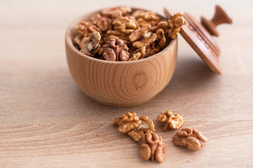 Peeled walnuts. On a wooden board. Healthy food. Natural background.