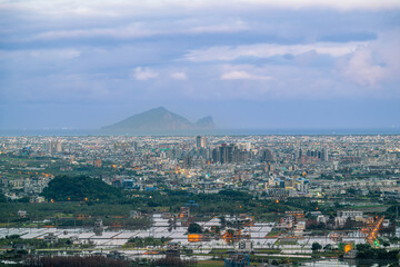 In the quiet afternoon, Yilan's city unfolds towards the horizon, where Turtle Island stands as a...
