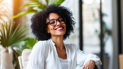 Senior woman laughing warmly, radiating joy and contentment in a serene moment.
