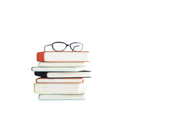 Pile of colorful hardcover books with eyeglasses placed on top, clean closeup layout, isolated on white background, concept of education and study. 3D Rendering.