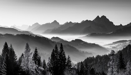 Obraz premium Mountain ranges in the morning haze black and white landscape