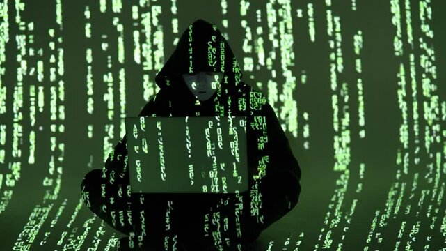 Zamaskowany haker siedzący po turecku w ciemnym pokoju otoczony kodem matrix &ndash; cyberatak, cyberprzestępczość, ciemna sieć, cyberświat, bezpieczeństwo danych, anonimowy haker, kodowanie