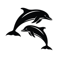 Fototapeta premium Two playful dolphins leaping in silhouette