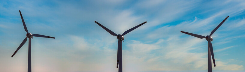 wind farm, wind turbine blades rotating with all weather capability, hybrid wind mill,