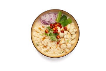 Garlic fried rice in a brown burnt ceramic plat topped with steamed crab meat, shallots, cucumber and red chili peppers  on isolated white background, Top view.