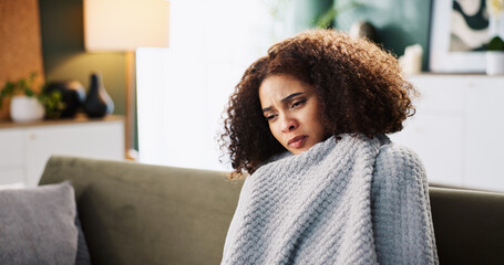 Tired, sick and blanket with woman on sofa for medical recovery, illness and flu season. Disease,...