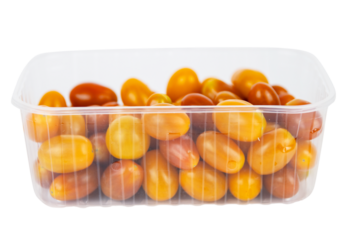 Plastic container of fresh yellow and orange cherry tomatoes isolated on white background. Tomatoes in transparent pack, perfect for grocery, retail, and food market visual content. Copy space