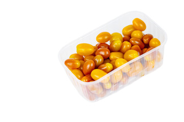 Plastic container of fresh yellow and orange cherry tomatoes isolated on white background. Tomatoes in transparent pack, perfect for grocery, retail, and food market visual content. Copy space