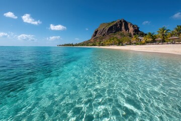 Fototapeta premium Tropical beach paradise. Crystal clear water, white sand, and lush greenery.