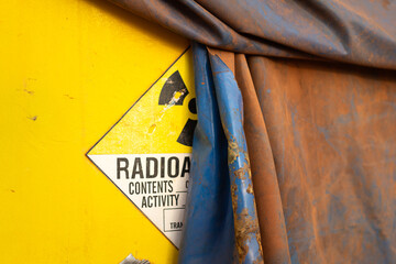 A hazardous material containment with radioactive symbol that hidden by the canvas. 