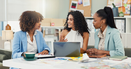 Laptop, fashion designer and talking with business women brainstorming project theme. Computer, collaboration and happy creative team planning, ideas and fabric color in meeting at startup office