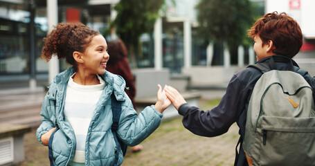 Children, handshake and happy with greeting at school, start and excited for learning in morning. Kids, friends and shake hands for education, development and scholarship with kindness at academy © BuyOutFelix01/peopleimages.com