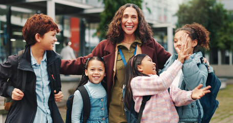 School kids, hug and teacher in portrait, outdoor and smile in city for solidarity, connection or together. Children, group and woman with embrace, education and welcome for scholarship at academy