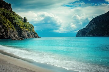 Fototapeta premium Turquoise cove, dramatic cliffs, sunlit beach