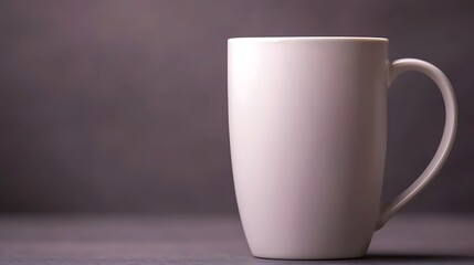 Obraz premium A plain white mug positioned on a textured surface with a subtle background, ideal for beverage photography